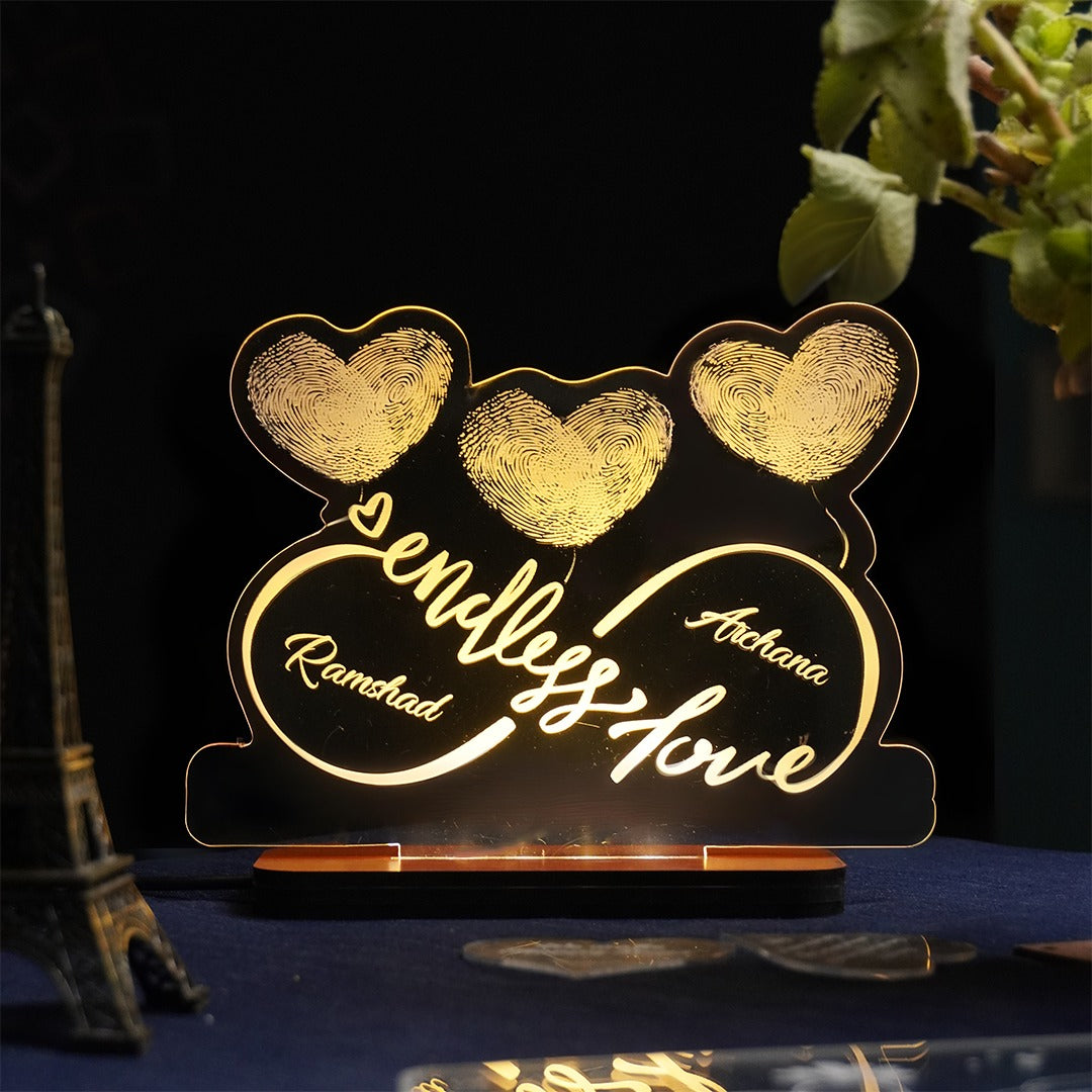 Custom LED acrylic plaque with intertwined couple fingerprints in heart shape and engraved names